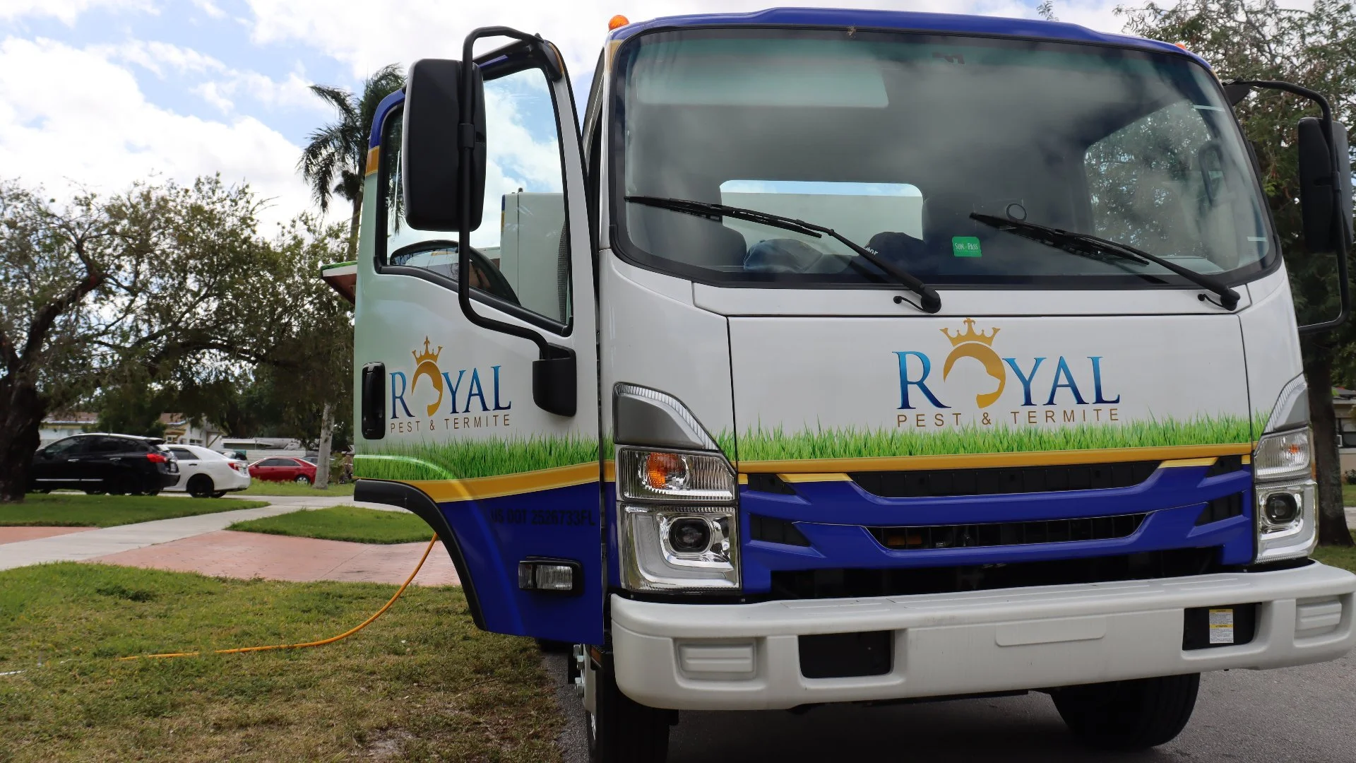 Royal Pest & Termite truck with door open in Miramar, FL.