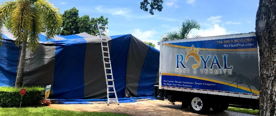 Truck in Miramar, FL, in front of a termite fumigation tent.