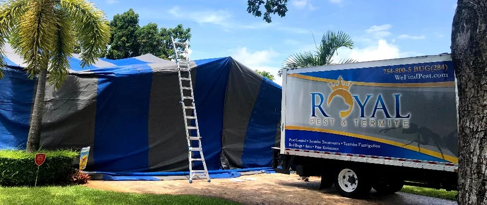 Truck near a fumigation tent in Key Biscayne, FL, for termite control.