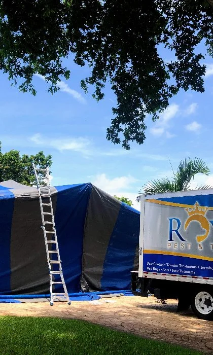 Home in Miramar, FL with a fumigation tent for termite infestations.
